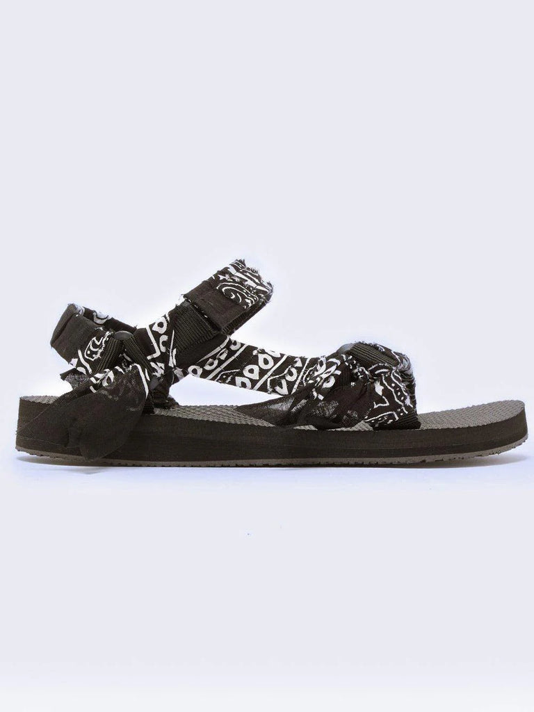 The Trekky sandals by Arizona Loves are known for their incredible comfort and their play on the “ugly shoe” look.   Made with recycled vintage cotton bandanas in black and white and recycled bottles for the base, they also have adjustable velcro straps.  Adding a fun and funky edge to your summer outfit, they look just as good in the city as on the beach.  