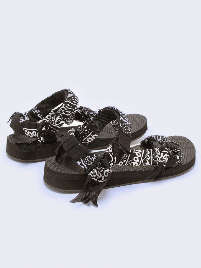 The Trekky sandals by Arizona Loves are known for their incredible comfort and their play on the “ugly shoe” look.   Made with recycled vintage cotton bandanas in black and white and recycled bottles for the base, they also have adjustable velcro straps.  Adding a fun and funky edge to your summer outfit, they look just as good in the city as on the beach.  