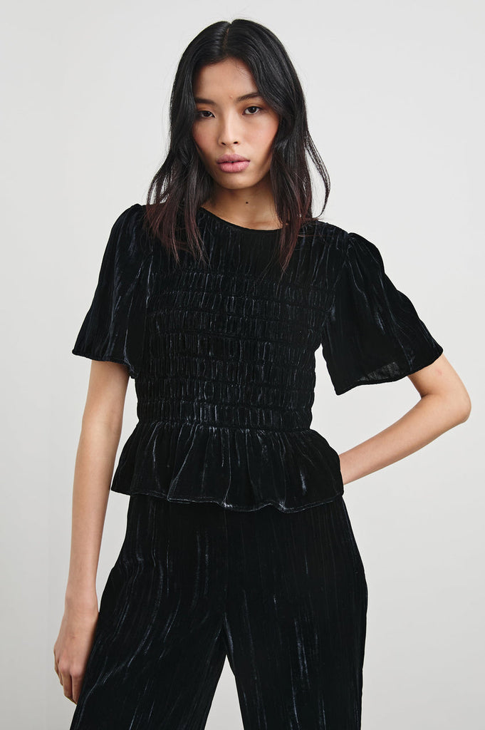 The pretty Rosie Top from Rails is crafted from a luxury crinkle velvet with a natural drape and features a neat nipped in waist.  Dress down with denim or dress this up with the matching Brissa Trousers fo an elevated evening look.     