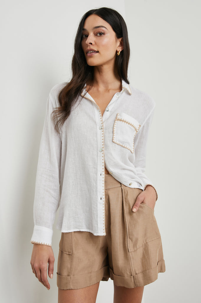 Charli is back in a white with a very cool embroidered blanket stitch in taupe.&nbsp; A favourite from Rails, the Charli is crafted from a super soft linen and rayon blend. It has a longer hem at the back, a single chest pocket and a relaxed body shape that flatters just about everyone. Pair with your denim for a lazy Sunday afternoon.