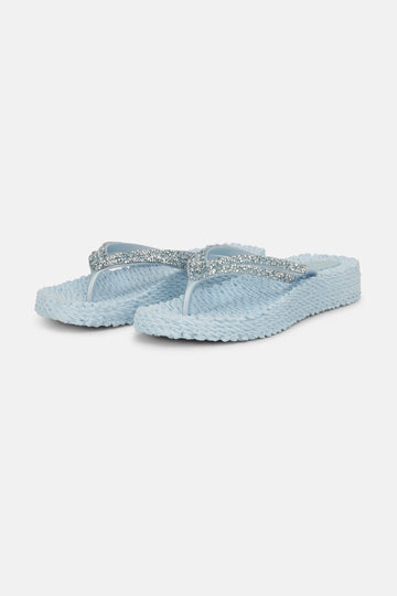 Slip on these super comfy platform flip flops by Ilse Jacobsen which will take you from beach days to nights out. The pale blue and rhinestone finish adds a touch of glamour and the textured sole not only gently massages your feet but is made from Air Rubber keeping the shoe lightweight and flexible. Other styles and colours available in store.


