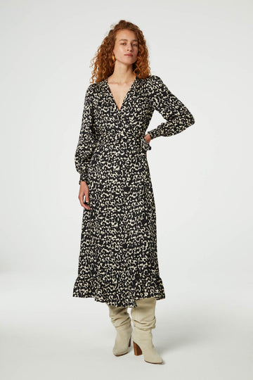 The Natalia Dress from Fabienne Chapot features a v-neckline, light balloon sleeves and smocked cuffs. This versatile wrap dress ties at the side and is in neutral subtle leopard print. Perfect with boots and/or sandals - this dress can easily be dressed up or down.