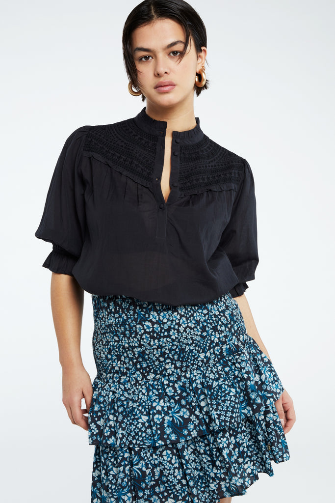 The Alena Top from Fabienne Chapot features short puff sleeves, fabric covered buttons and slight ruffle details. Wear with jeans and trainers for easy everyday styling or equally dress up with a skirt and heels.