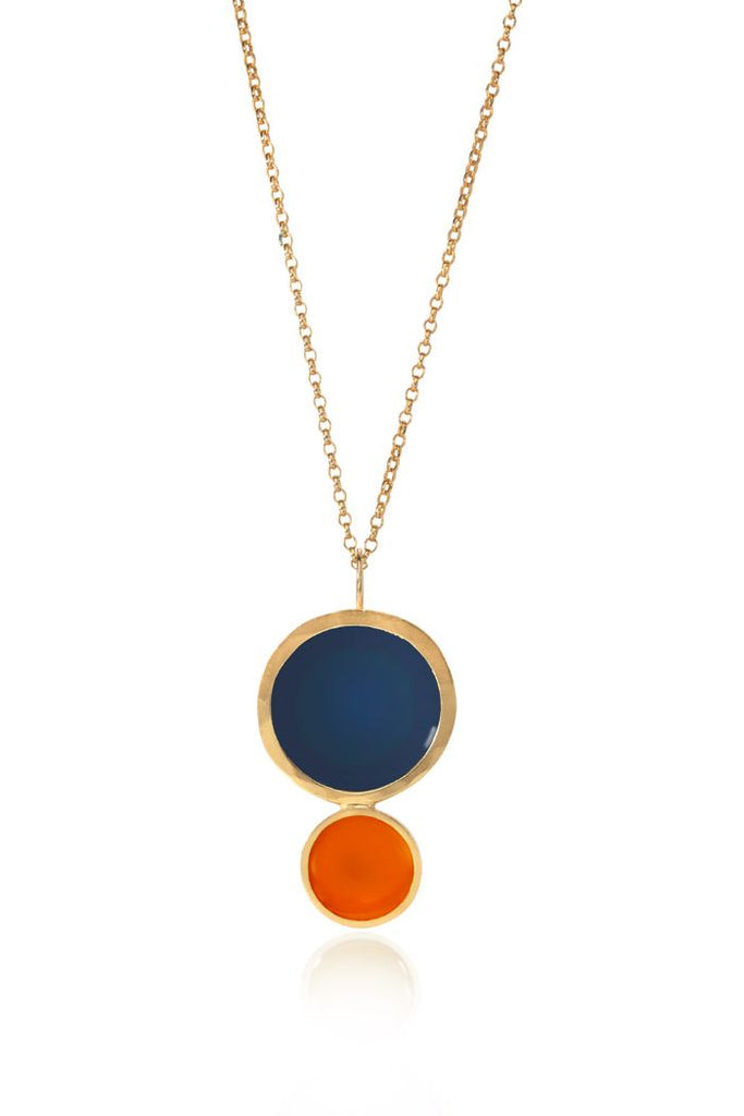 This unique blue and orange enamelled pendant combines modern and organic shapes with a pop of colour. Crafted from Fairmined Gold this stunning pendant is bound to be worn again and again. Available in other colours in store!