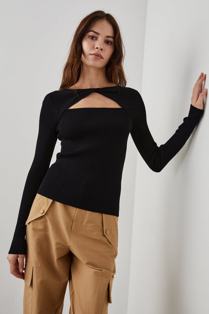 Erina is a great little ribbed knit with a body hugging fit, twist and cutout detail and in always wearable black.  Super soft but also super sexy this is great paired with the black Rails Davina skirt or your favourite black denim.
