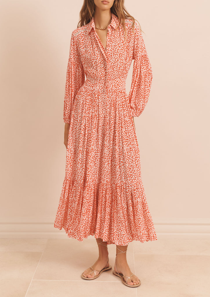 The Sienna Dress from EVARAE is a button fronted shirt dress with opulent puff sleeves. This easy to wear piece is perfect for dressing up or down for any Summer occasion and looks fab paired with espadrilles and gold jewellery.