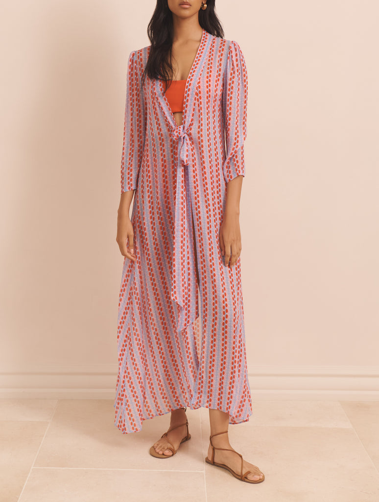 The Agata Dress from EVARAE doubles up as an effortless kaftan and features a bow that ties at the chest, gathered sleeves and a maxi length. This colourful two-in-one takes you from beach to dinner in a instance.