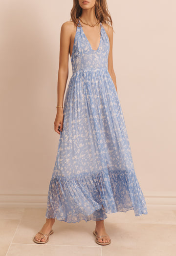 <p>The Evie Dress from EVARAE is a beautifully effortless strappy maxi dress that features a tie-able halter neckline and a voluminous skirt. Fitted at the waist-band this floaty dress is super flattering and perfect for a Summer occasion.