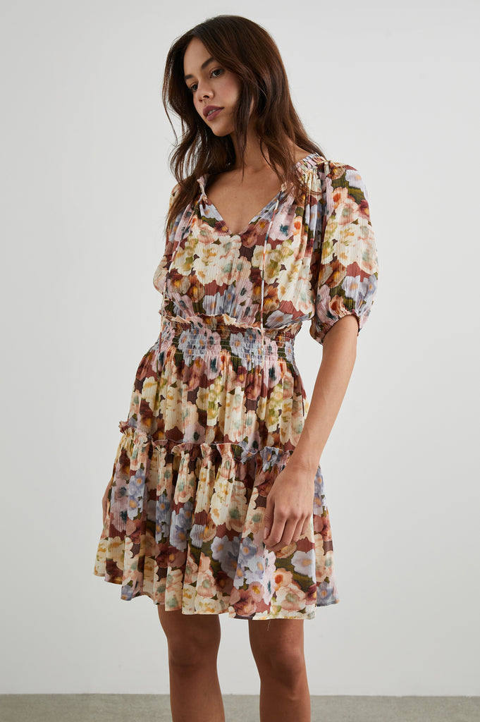 The Fiorella dress from Rails is crafted from their signature super soft fabric in a gorgeous floral print.  This is an easy throw on and go dress and perfect for the change in seasons. Featuring a crew neckline with self ties, short sleeves, an elasticated waistline and a flowy feminine ruffled and tiered skirt.  This looks great paired with trainers for a relaxed daytime look or pair with a heel for a more sophisticated evening vibe.