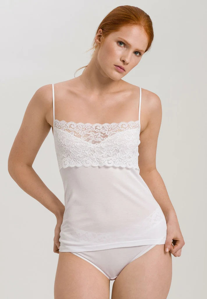 The Moments Spaghetti Strap Top from Hanro is a luxury piece made for everyday wear. Crafted from mercerised cotton, this easy basic features a sweetheart neckline overlapped with a intricate lace panel across the bust. With adjustable straps, this luxurious vest offers the perfect fit. 