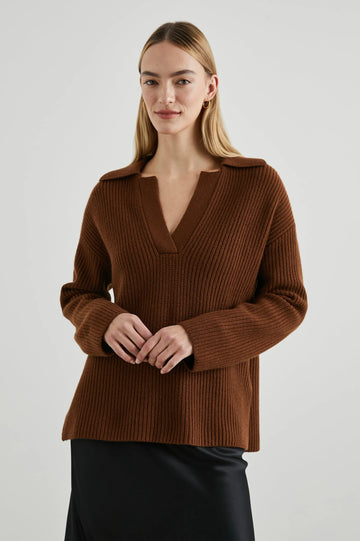 Effortlessly transition into the colder months with this cosy wool polo sweater. Featuring an exaggerated collar, deep v-neckline and dropped shoulders - this sweater comes in a slightly oversized fit. Pair with your favourite denim for easy weekend dressing.