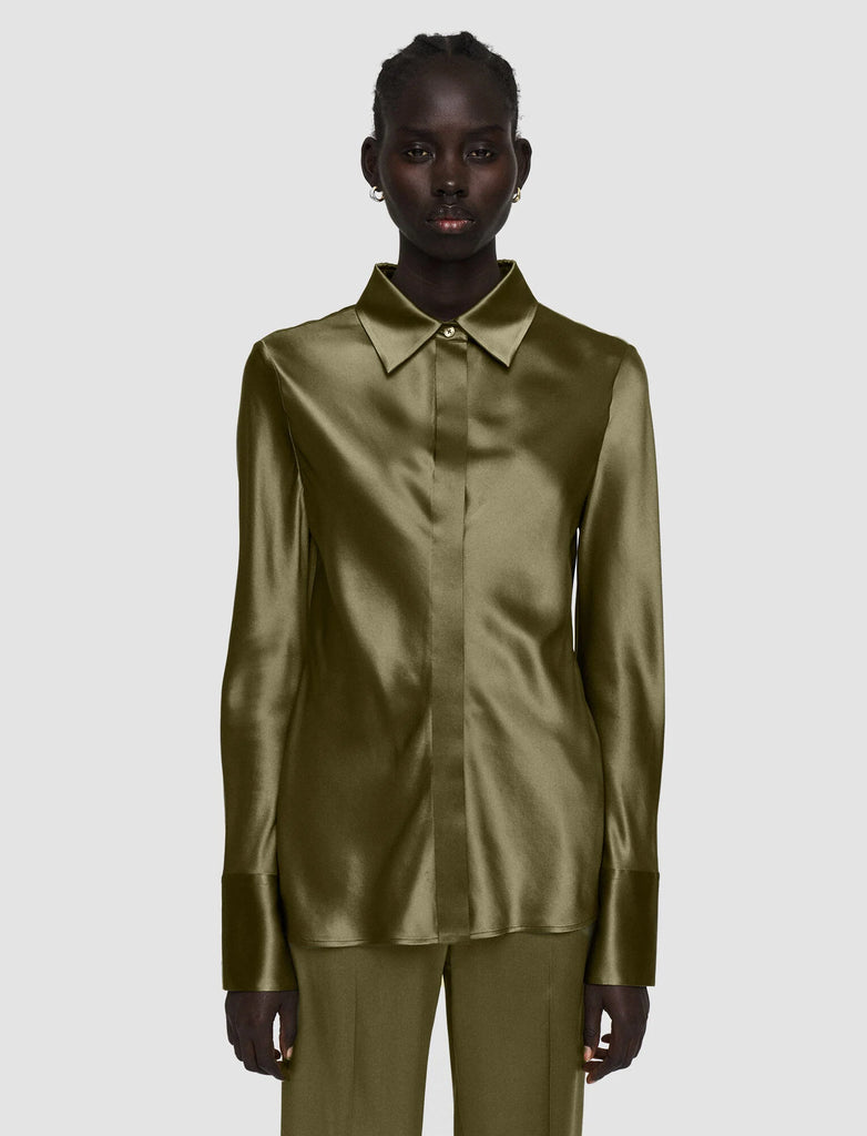 The Brunel Satin Blouse from Joseph is crafted from a smooth lustrous silk. Featuring a slim fit and a hidden placket with button fastenings - this shirt effortlessly adapts to the shape of your body. Wear with the Tova Olive Trousers for the full look.