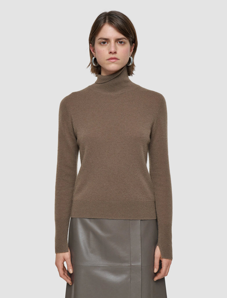This lovely turtleneck is crafted from the softest cashmere which give it it's signature lightweight and luxuriously soft feel.&nbsp; A wardrobe essential&nbsp; and featuring ribbing at the neckline, hem and cuffs this will certainly become a jumper you reach for again and again.