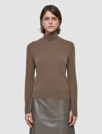 This lovely turtleneck is crafted from the softest cashmere which give it it's signature lightweight and luxuriously soft feel.&nbsp; A wardrobe essential&nbsp; and featuring ribbing at the neckline, hem and cuffs this will certainly become a jumper you reach for again and again.