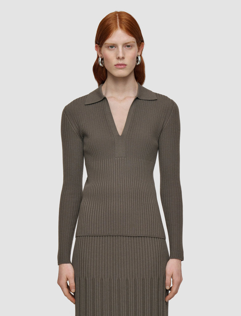 This lovely jumper is crafted from super soft merino wool and features a sporty polo neck, deep v and ribbing throughout.&nbsp; In a great neutral colour this will quickly become a jumper you reach for when you want to look smart but effortless.&nbsp;