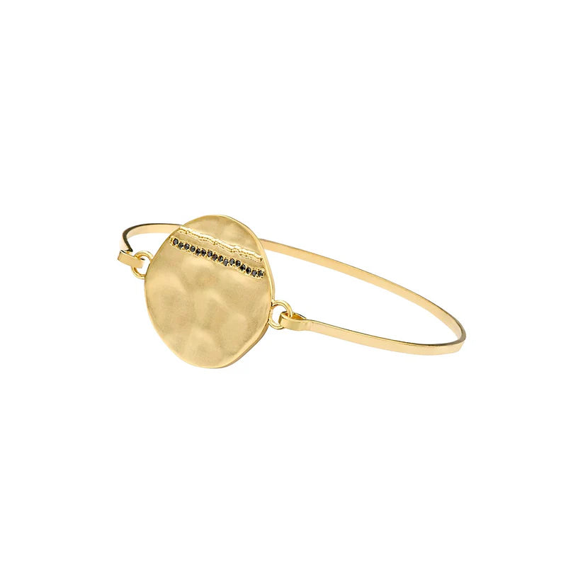 The Janis collection is a must for your jewellery box!  This simple yet elegant bracelet is timeless.  Featuring a small gold plated disc paved with black zirconia it will elevate any outfit.  Pair with the matching necklace.  Great for day or night.   