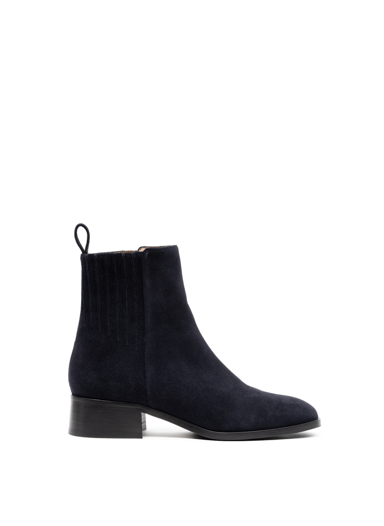 We've found the perfect walking boot in always wearable navy.&nbsp; With an easy to put on side zip and crafted from gorgeous kid suede these ankle boots are super comfortable and perfect for everyday wear.