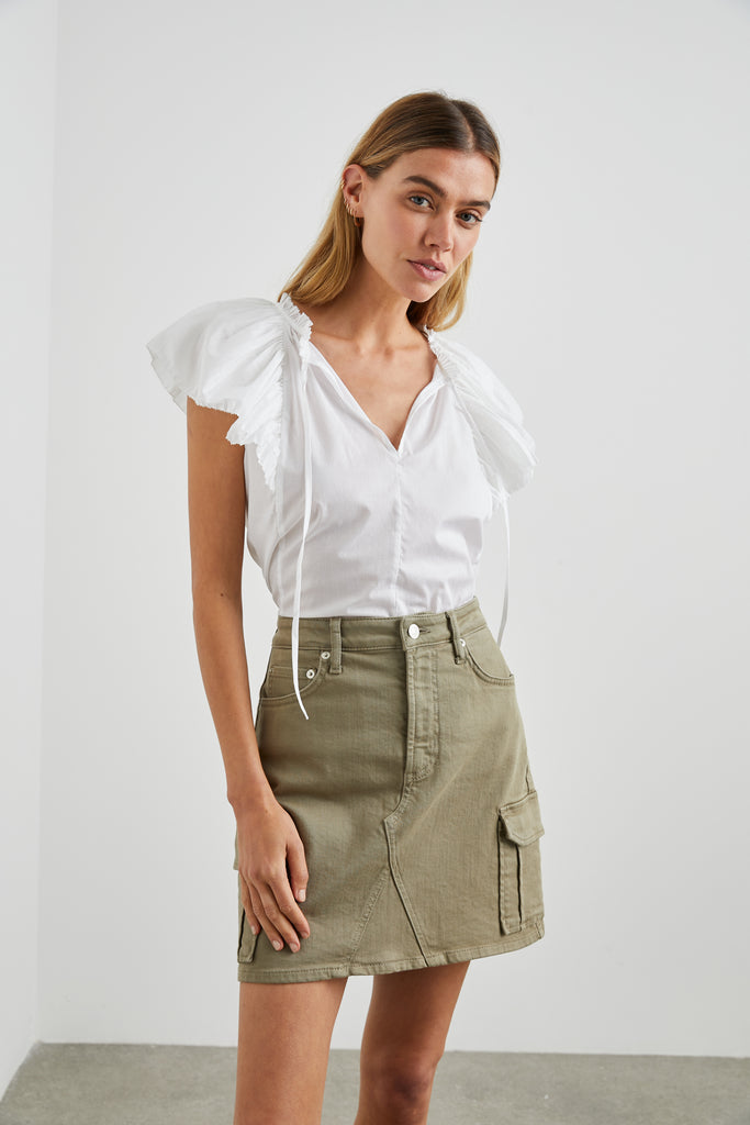 The Laurel Skirt from Rails is a classic mini skirt with a zipper fly and cargo pockets at each side. The olive tone makes this the perfect denim skirt for transitioning into the new season. Wear with trainers for an easy casual look.