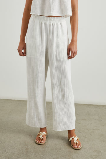 Crafted from Rail's signature super soft, breezy double gauze cotton these pull on trousers in always wearable white definitely deserve a place in your closet.&nbsp; Featuring flattering side slits at the outer leg opening and a smocked waistband these are just the thing for lazy weekends and warmer days.&nbsp; A new wardrobe staple!