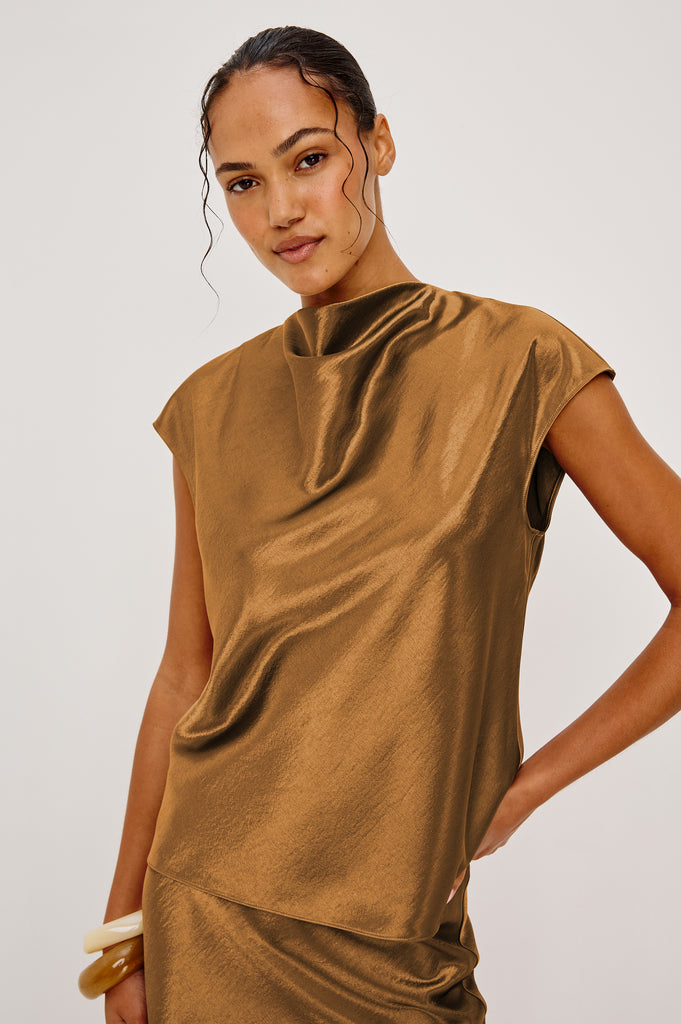 Loretta definitely deserves a place in your wardrobe.&nbsp; This will quickly become one you reach for again and again.&nbsp; A sleeveless mock neck is a timeless silhouette and the draping around the chest makes is very flattering.&nbsp; Pair with the matching Silvi trousers for a cool co-ord vibe!&nbsp;