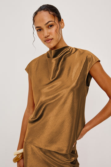 Loretta definitely deserves a place in your wardrobe.&nbsp; This will quickly become one you reach for again and again.&nbsp; A sleeveless mock neck is a timeless silhouette and the draping around the chest makes is very flattering.&nbsp; Pair with the matching Silvi trousers for a cool co-ord vibe!&nbsp;