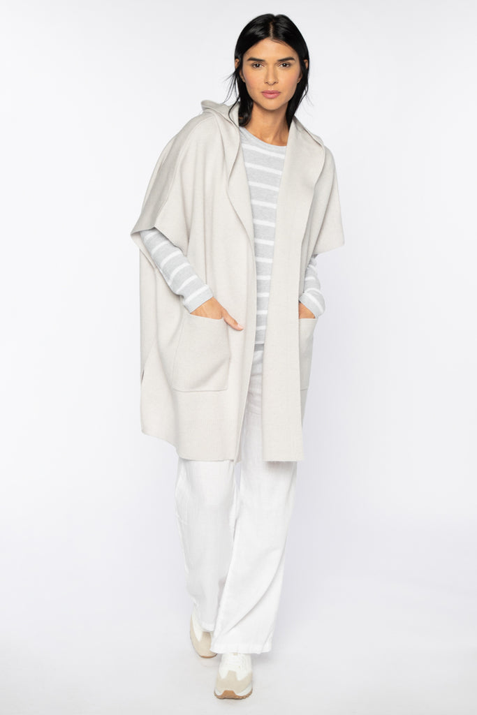 This Doubleknit Cardigan from Kinross in Birch, is sleeveless and features a hood as well as two front pockets. This relaxed over-sized cardi is great for transitioning into Spring, layered over a light-weight knit. 