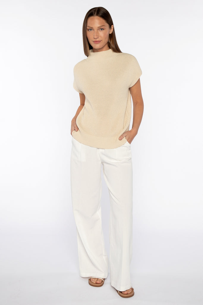 This cap sleeve cotton top from Kinross is hugely versatile and ever so pretty and soft.&nbsp; In a creamy parchment colour and featuring a mock turtleneck and cap sleeves this is perfect on it's own with your favourite white denim but you could also put a long sleeved tee under it for a bit of extra layering. 