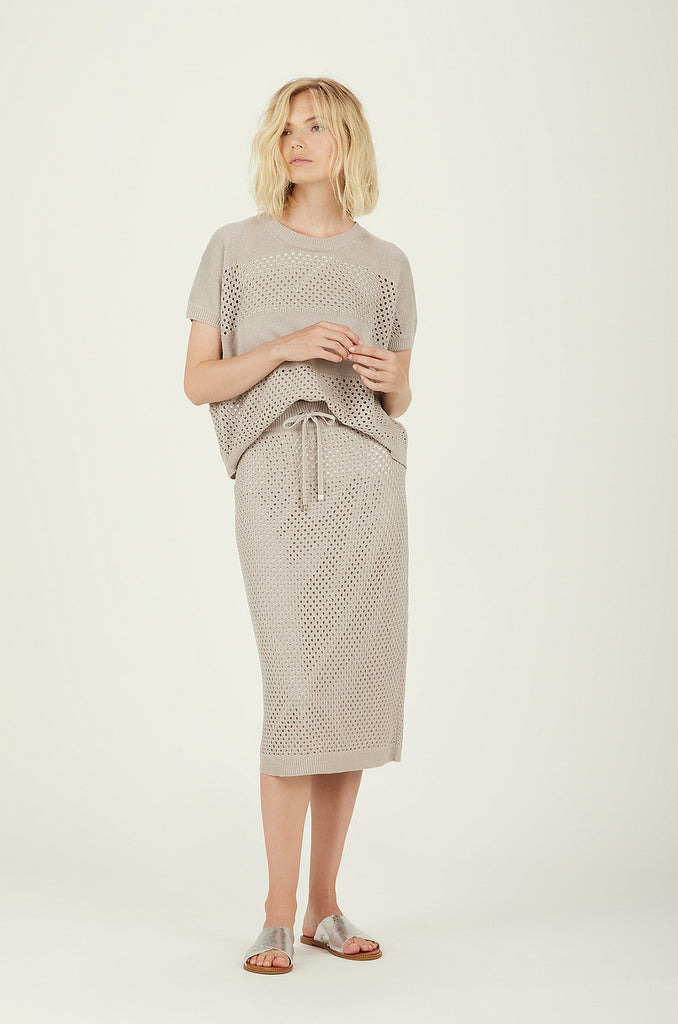 This Crochet Midi Skirt from Le Tricot Perugia is crafted from a linen and cotton blend. Full lined and featuring adjustable ties at the waistband - this skirt can be dressed up or down. The neat shape offers a flattering fit yet the fabric provides comfortable movement. 