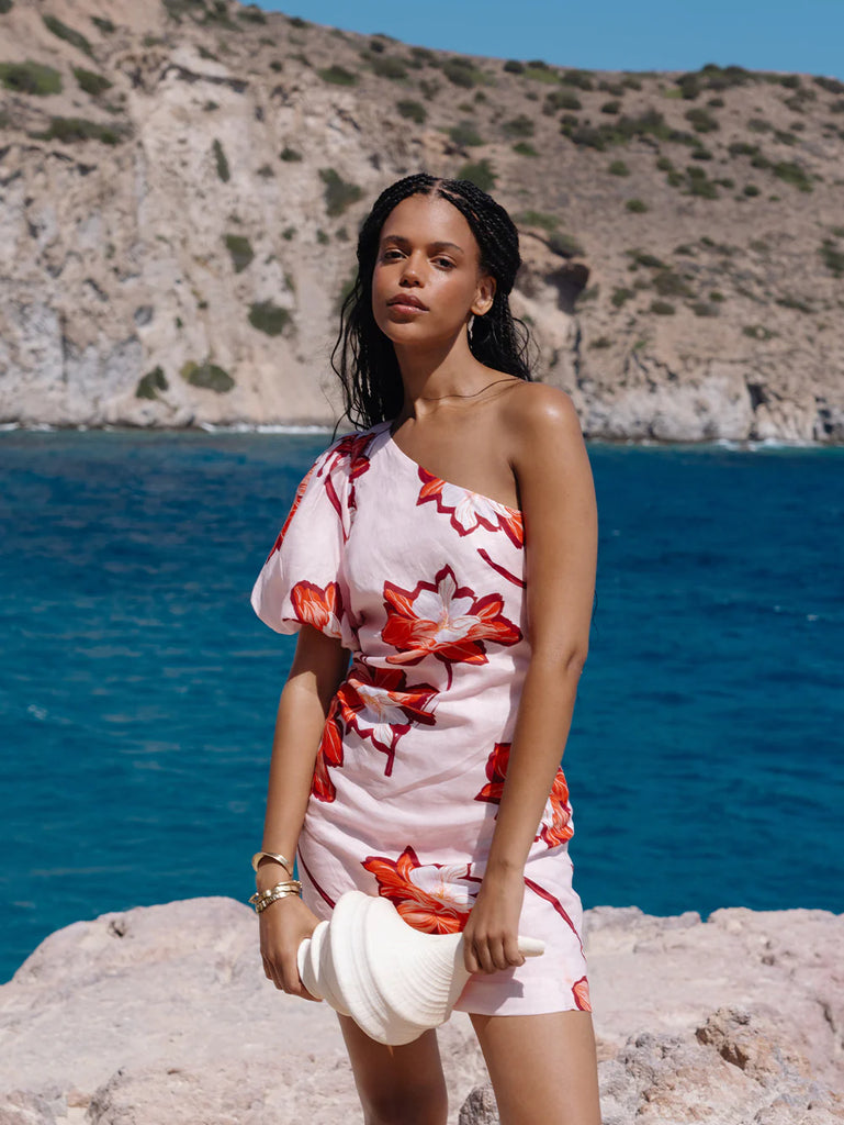 We are delighted to be stocking uber cool Australian brand Kivari.&nbsp; Here we have one of their gorgeous mini dresses!&nbsp; This mini comes in a a statement large scale floral print with tones of pink on a white base and features a sexy one shoulder and puff shoulder.&nbsp; Super feminine and flirty this dress will definitely get you noticed!