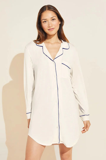 A classic menswear shaped sleepshirt from Eberjey that is loaded with feminine touches. Crafted from scrumptiously silky soft fabric in ivory with navy piping you won't ever want to take this off. The sleepshirt conveniently offers more coverage than a nightie but falls just above the knee so you won't get too hot! Sweet dreams!