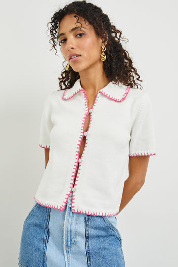 We love a pretty top and the Maliah Top from Rails does not disappoint. This pretty little knit top features a preppy collar, centre buttons, blanket stitch detailing at the neck, sleeve, hem and centre and comes in white with feminine pink accents.&nbsp; This blouse is perfect paired with your favourite denim!