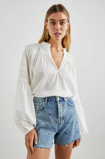 Marli is an incredibly easy to wear top from Rails.&nbsp; Crafted from Rails signature super soft fabric and featuring a flattering v neck, pleat detailing at the collar, chest and arm and elasticated wrists this looks perfect paired with your favourite denim or shorts for a laid back easy look.
