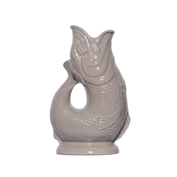 These stunning handmade "Gluggle Jugs" make the perfect gift or addition to your home. They are a perfect centrepiece for your table and, as well as being used to serve water, they can also be used as a quirky vase, a utensil holder or as a decorative piece. Manufactured in England since the 1870's they are iconic because they make a delightful "gluggle" sound when poured! The only question is, which colour to buy?!