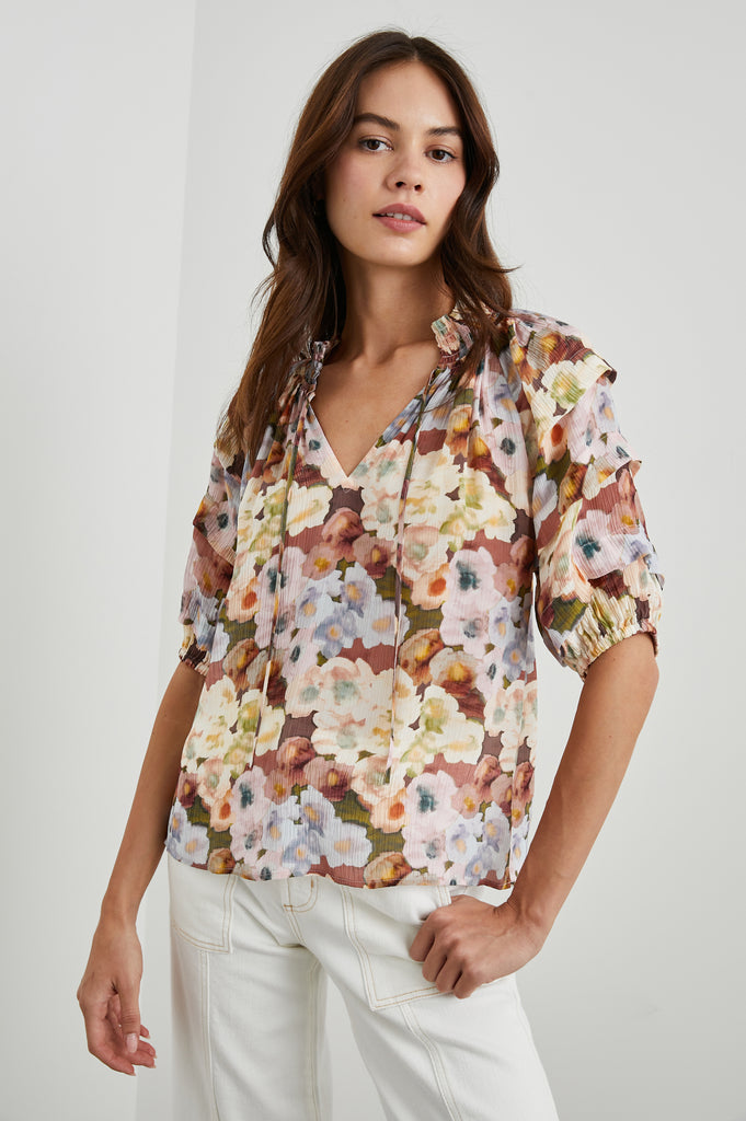 What a pretty, feminine blouse from Rails!  Featuring a multi-coloured floral print, smocking at the collar, deep pleats on the sleeves with a elasticated cuffs - this is perfect paired with your favourite Paige denim shorts or white jeans.