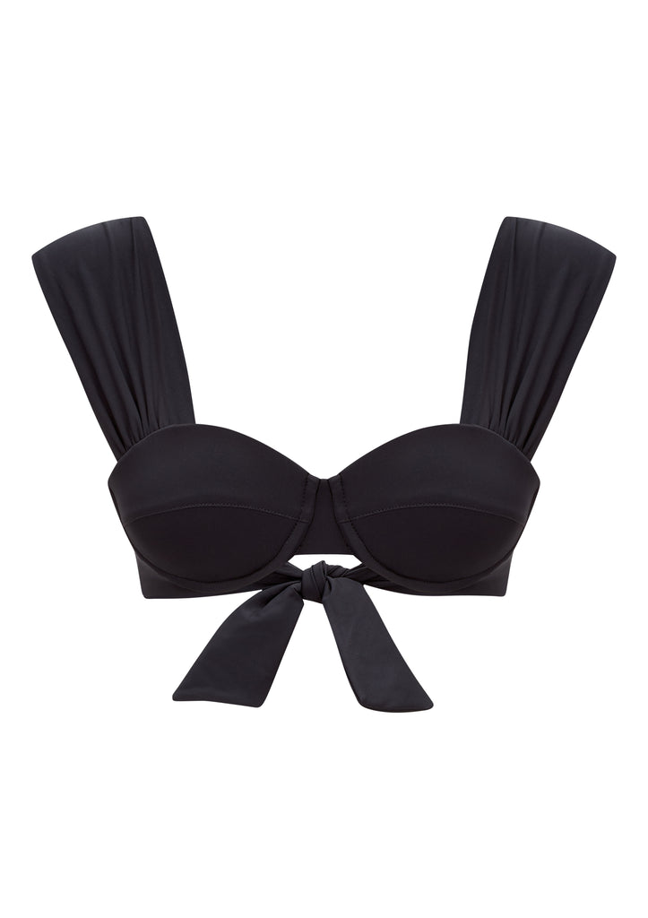 The Audrey Bikini Top from EVARAE features a flattering neckline, built-in cups with underwire and a bow tie up detail at the back. In a classic black this bikini top is a must have for your next getaway with the matching Elena Bikini Bottoms.