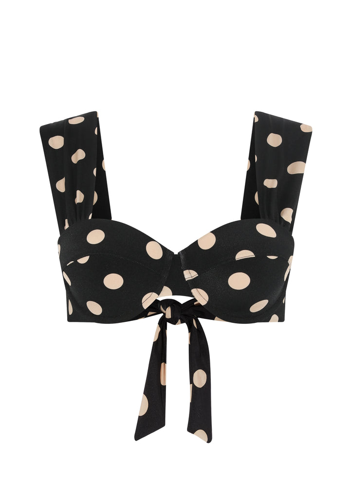The Audrey Bikini Top from EVARAE features a flattering neckline, built-in cups with underwire and a bow tie up detail at the back. In a black and almond polka dot this bikini top is a must have for your next getaway with the matching Elena Bikini Bottoms.
