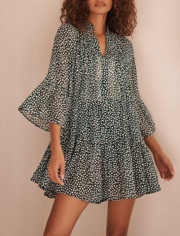 <p>The Loli Dress from EVARAE features pleating at the front and back giving volume to the skirt and a slightly longer length at the back to provide coverage. Crafted from a light georgette material with a ditsy floral print, this mini dress is the ideal beach to dinner dress.