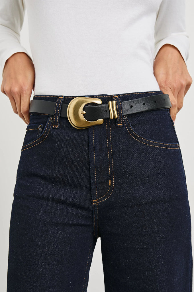 It's not just a belt - it's a Rails belt!&nbsp; &nbsp;Crafted from 100% Italian leather the black version features extra loops for an adjustable hip to waist fit and a nice chunky buckle.&nbsp; Perfect with denim or wrapped around the waist of your favourite dress this is a classic that will never go out of style.