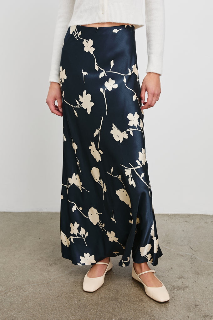 Say hello to Romina!&nbsp; She will quickly become your go to skirt!&nbsp; In a gorgeous dark luxurious blue with a rose motif this maxi is perfect paired with a lovely white knit or tee for a laid back effortless vibe.&nbsp; Definitely worth a spot in your skirt collection!