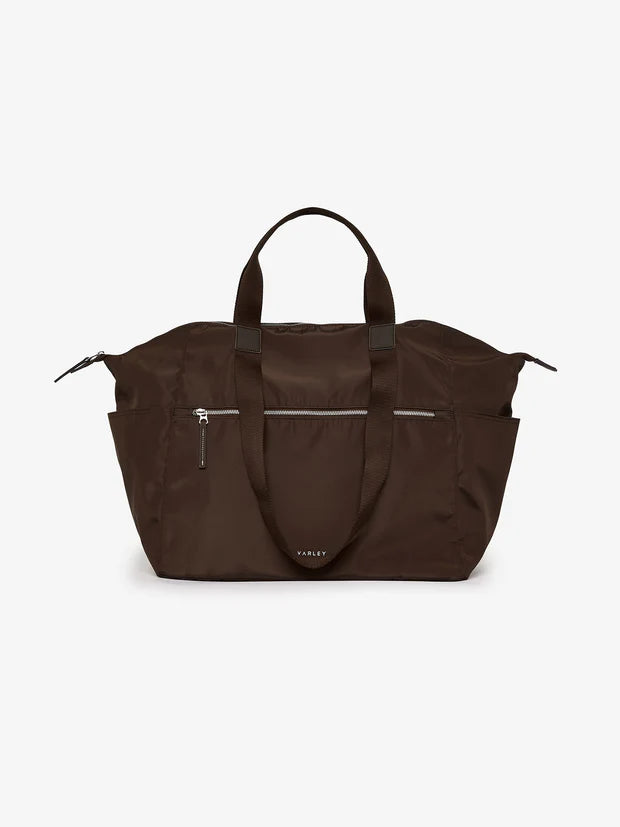 Packing will no longer be a chore with this rich chocolate brown weekender from Varley.  Made in a lightweight nylon with a zip up internal and external pocket, removable strap and water bottle holder, all your essentials will fit neatly within.  Packing down to next to nothing aswell it is perfect for days out or the extra bag you may need.