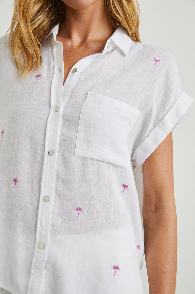 Can one ever have enough lightweight linen tops in the Summer?!&nbsp; This pretty short sleeved button down top&nbsp;from our go to casual brand Rails features a longer hem in the back and a relaxed flattering shape.&nbsp; &nbsp;This season Rails has done it in a preppy light blue stripe - perfect with white denim.