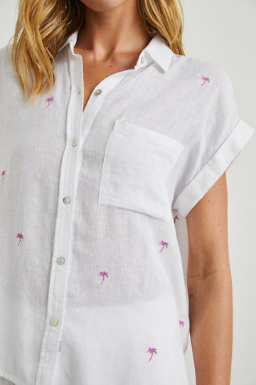 Can one ever have enough lightweight linen tops in the Summer?!&nbsp; This pretty short sleeved button down top&nbsp;from our go to casual brand Rails features a longer hem in the back and a relaxed flattering shape.&nbsp; &nbsp;This season Rails has done it in a preppy light blue stripe - perfect with white denim.