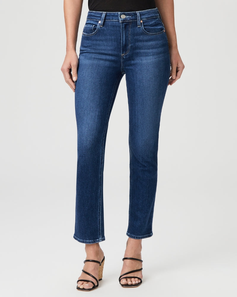 These high-rise, medium wash, straight jeans from Paige finish at the ankle with a raw hem. Cut from PAIGE's Vintage denim, the combination of comfort and stretch provides everything you love about authentic vintage denim. These super soft jeans feel perfectly lived-in from your very first wear. 