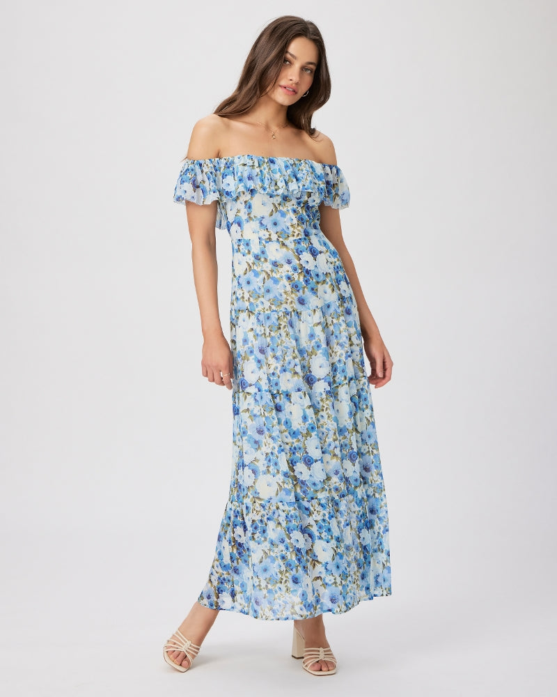 If you're looking for a WOW dress Carmelia from Paige is just what you're after!&nbsp; Crafted from airy textured silk georgette in a gorgeous pale blue garden print this dress features short off the shoulder sleeves, a fitted bodice, a tiered skirt with a flirty slit and removable straps.&nbsp; Definitely worthy of a special occasion but also great with a flat sandal or trainer for an effortless dressed down look.