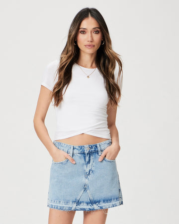 Denim skirts are trending! This mini version is perfect and can be worn with anything from trainers to pretty little sandals. Crafted from super soft denim, this skirt has a hint of stretch for comfortable movement. This mini features natural fading and a raw hem for a touch of style - an essential wardrobe basic.