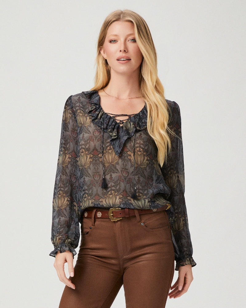 The Ilara Blouse from Paige is a collaboration piece with Morris & Co. In an ornate floral brocade design this blouse is crafted from 100% crinkled silk georgette. Featuring long sleeves with a subtle frill cuff, ruffle detailing at the neckline and a lace up detail with tassel trims - Ilara will be your new go-to for day to night styling.