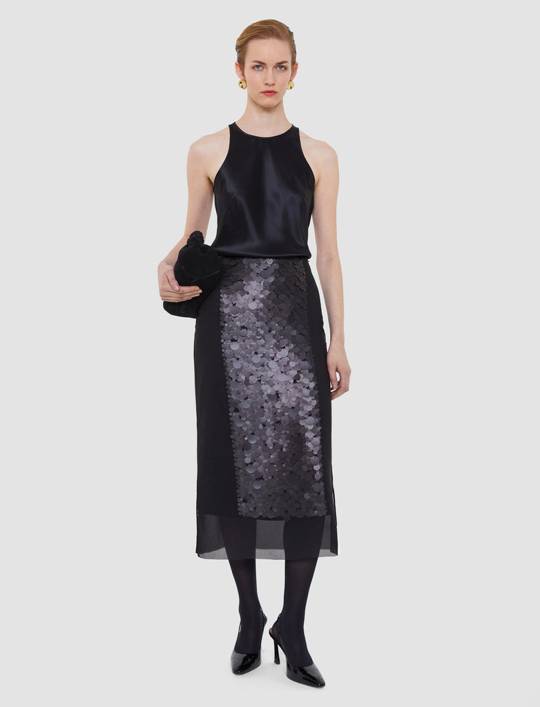 The Combo Chiffon Sequin Skirt is a wow piece!&nbsp; Featuring an a line shape, a sheer chiffon overlay embellished with matte sequins and an underskirt this piece drapes beautifully and catches the light - making you a bit sparkly! Perfect for your next black tie event or a special evening out!