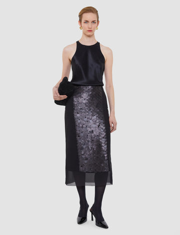 The Combo Chiffon Sequin Skirt is a wow piece!&nbsp; Featuring an a line shape, a sheer chiffon overlay embellished with matte sequins and an underskirt this piece drapes beautifully and catches the light - making you a bit sparkly! Perfect for your next black tie event or a special evening out!