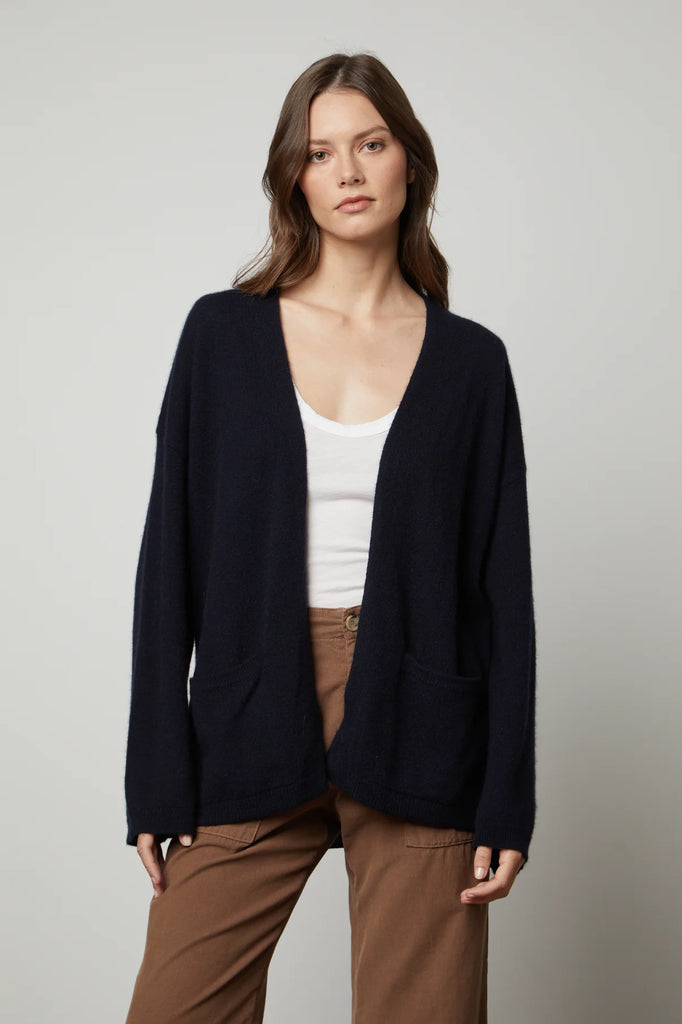 Indulge in pure luxury with this 100% cashmere cardigan from Velvet by Graham & Spencer. Lila features dropped shoulders, a easy open front and two patch pockets. This cardi is bound to lift any basic outfit!