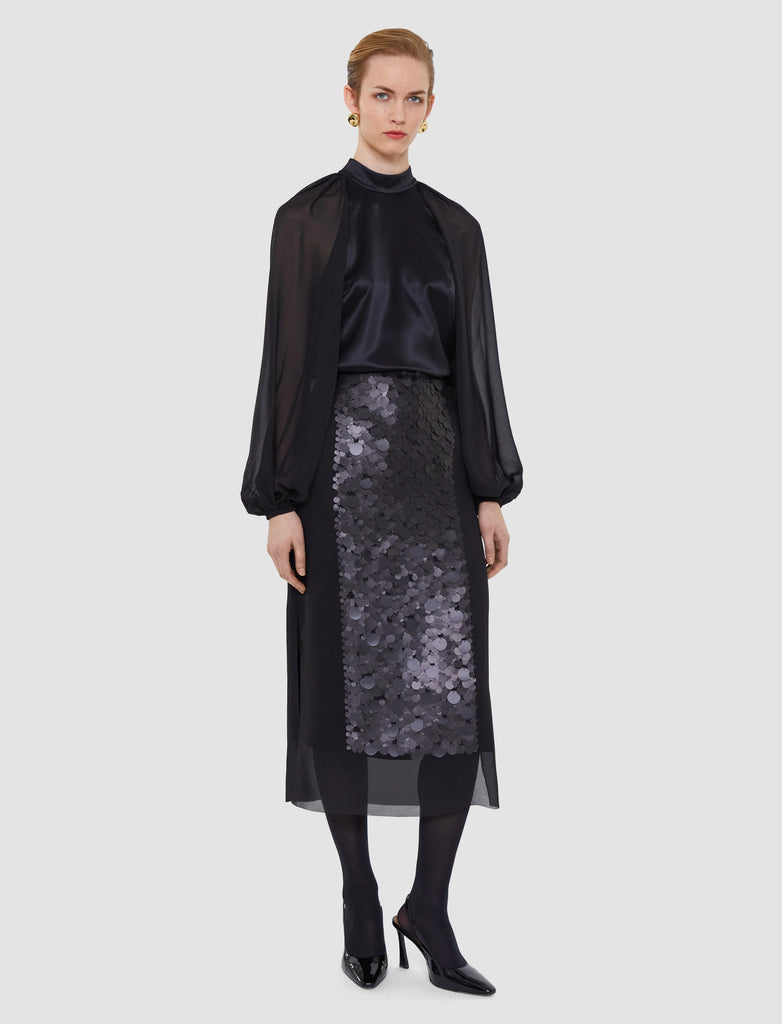 The Cava Double Satin Blouse from Joseph is a piece that will never go out of style!&nbsp; Crafted from a responsibly sourced fabric known for it's lustrous silk like texture and featuring gorgeous sheer voluminous sleeves and a relaxed effortless fit this is the perfect match for your black trousers or skirts for evening.
